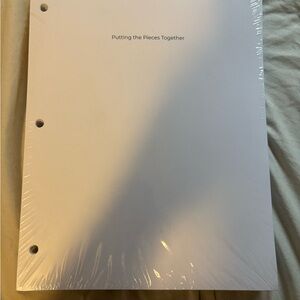 White Binder with Text - Putting the Pieces Together